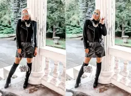 Stylizacja: czarna skórzana spódnica, ramoneska, wysokie kozaki i torebka. Idealna inspiracja, co założyć do czarnej skórzanej spódnicy.