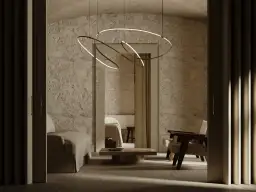 Nowoczesne lampy na poddasze skosy, wiszące nad kamiennym wnętrzem z sofą i fotelami.