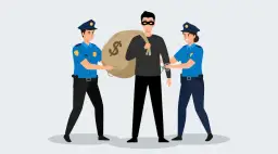 Dwóch policjantów aresztuje złodzieja z workiem pieniędzy.