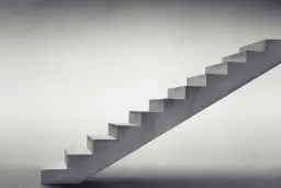 Minimalistyczne schody zabiegowe betonowe wiodą w górę, symbolizując postęp i rozwój.