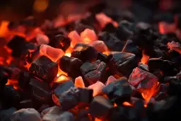 Żarzące się węgle, które mogą być przyczyną, dlaczego piec na ekogroszek wygasa.