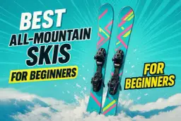 Najlepsze narty all mountain ranking dla początkujących. Kolorowe narty z wiązaniami na tle nieba i śniegu.