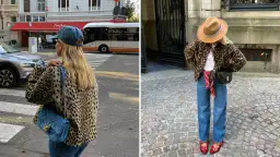 Kobieta w panterkowej kurtce i jeansach, z kapeluszem na głowie, spaceruje po brukowanej ulicy.