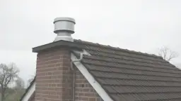 Jak zakończyć komin: Kluczowe kroki, aby uniknąć problemów z dymem