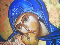 Ikona Matki Boskiej z Dzieciątkiem Jezus, w niebieskim welonie, na złotym tle.