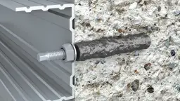 Przekrój futryny aluminiowej z kotwą w betonie.