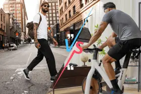 Man walking on city street vs man riding a stationary bike.