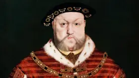 Porträt von Heinrich VIII. in prächtiger Kleidung. Seine vielen Ehepartnerinnen kannten seine Macht.