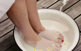 A relaxing foot soak with Epsom salts and chamomile flowers. Discover what to soak feet in for detox and rejuvenation.