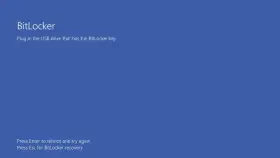 Ekran BitLocker: podłącz USB z kluczem BitLocker. Naciśnij Enter, by zrestartować, lub Esc, by odzyskać dostęp.