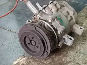 A car's AC compressor, a key component for cool air. Considering the ac compressor replacement cost? This part is vital for your comfort.