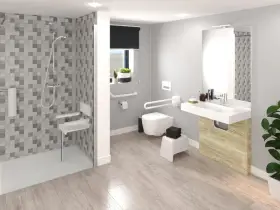 Salle de bain moderne avec douche, lavabo et toilettes adaptées. Des barres d'appui et un siège de douche pliable assurent l'accessibilité.