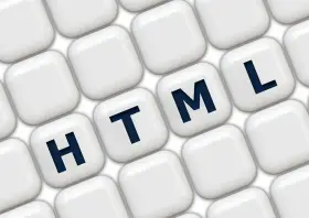 Klawisze z literami H, T, M, L układają się w słowo HTML, symbolizując podstawy programowania.