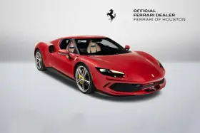 Czerwone Ferrari 296 GTB z beżowym wnętrzem, zaparkowane na białym tle. Obok logo Ferrari i napis "Official Ferrari Dealer Ferrari of Houston".
