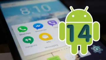 Zielony robot Android z numerem 14 na ekranie telefonu z ikonami aplikacji.