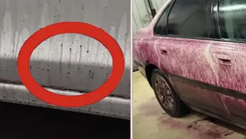 Bilens sida täckt av lila vätska, en flygrostlösare som visar sin effekt.
