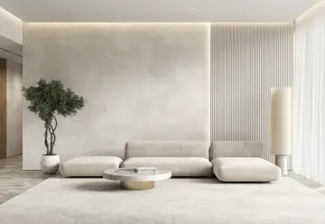 Minimalistyczny salon z beżowymi ścianami, wygodną sofą i dywanem. Idealne miejsce, by zastanowić się, jakie zasłony do beżowych ścian pasują najlepiej.