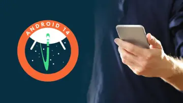 Logo Android 14 z rakietą w kosmosie obok dłoni trzymającej smartfon.