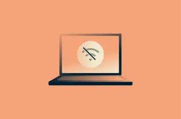 Laptop z symbolem przekreślonego Wi-Fi. Brak internetu uniemożliwia pracę.