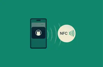 Telefon z ikoną płatności zbliżeniowych i symbolem NFC, gotowy do transakcji.