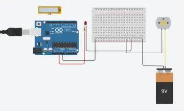 Schemat połączeń Arduino Uno z silnikiem i baterią 9V. Widać płytkę styków, diodę LED i miernik. GND to punkt wspólny masy.