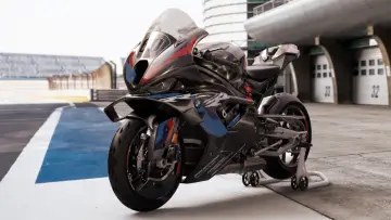 Czarny, sportowy motocykl BMW M 1000 RR, najszybszy ścigacz na świecie, gotowy do wyścigu na torze.