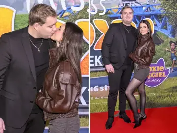 Kevin Mglej i jego partnerka na premierze filmu. Ona w brązowej kurtce, on w garniturze.