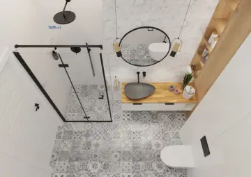 Wzorowa łazienka z prysznicem walk-in, umywalką nablatową i toaletą. Wnętrze zdobią geometryczne płytki i drewniane elementy.
