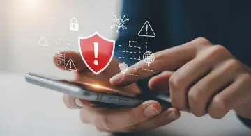 Ochrona telefonu przed wirusami. Ikony symbolizujące bezpieczeństwo i zagrożenia nad smartfonem.
