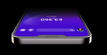Telefon z aplikacją Revolut, pokazujący saldo £3,350. Dowiedz się, jak założyć konto Revolut i zacząć zarządzać finansami.