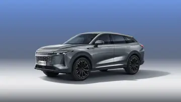 Elegancki, szary SUV OMODA 9 hybryda z nowoczesnym designem i czarnymi felgami.