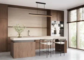 Nowoczesna kuchnia z wyspą. Jak zaplanować oświetlenie nad wyspą kuchenną inspiracje i wysokość? Elegancka lampa zwisa nad blatem.
