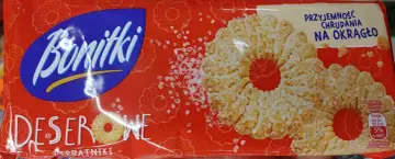 Opakowanie ciastek "Bonitki" z napisem "Przyjemność chrupania na okrągło". Widać na nim okrągłe, deserowe ciastka posypane cukrem.