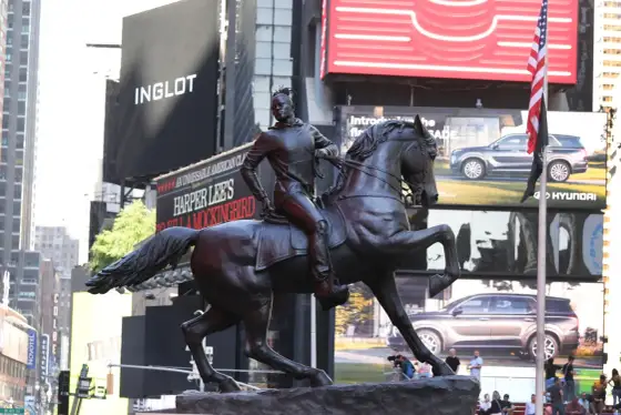 Times Square Statue - What It Means & How to See It