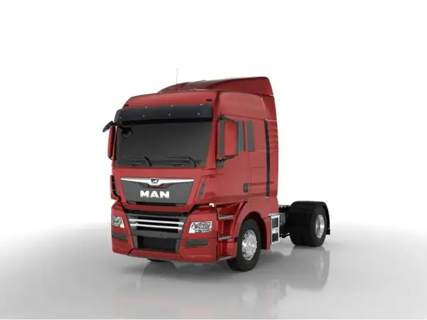 Cabine rouge d'un camion MAN, prête pour une longue route. Ce camion américain est un géant des autoroutes.