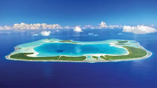 En grönskande atoll med turkost vatten, en dröm om Franska Polynesien.