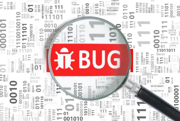 Lupa powiększa symbol owada i napis "BUG", wyjaśniając, czym jest debugowanie.