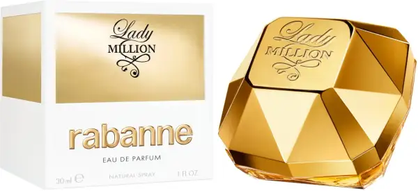 Złoty flakon perfum Lady Million od Rabanne, przypominający diament, obok białego pudełka z napisem "one milon".