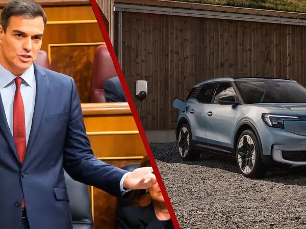 Pedro Sánchez en el Congreso, mientras un coche eléctrico espera su turno en la lista de espera del plan moves iii.