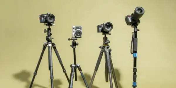 Four cameras on tripods, showcasing options for how to choose a tripod for your photography needs.