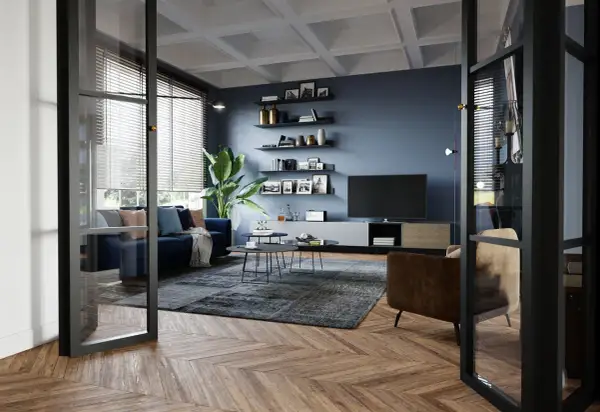 Soggiorno moderno con divano blu, poltrona marrone, tappeto grigio e TV. Idee su come arredare un soggiorno con stile e funzionalità.