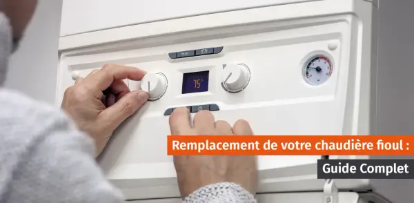 Main tenant un bouton de réglage sur une chaudière. Un guide complet sur le changement de chaudière fioul.