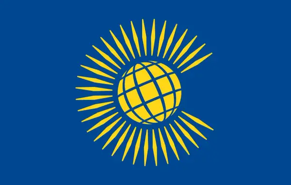 Bandera azul con un globo terráqueo amarillo rodeado de rayos amarillos, representando el Commonwealth.