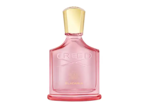 Różowa butelka perfum Creed Eladaria ze złotą nakrętką.