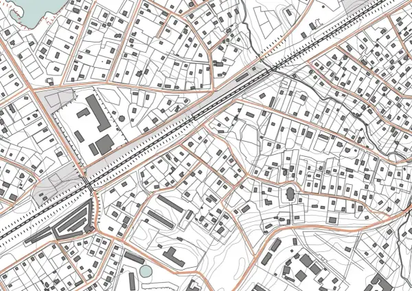 Szczegółowa mapa sytuacyjno wysokościowa z zaznaczonymi budynkami, drogami i liniami kolejowymi.