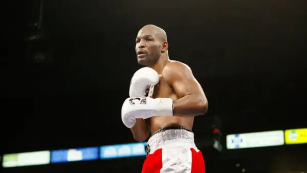 Bernard Hopkins training in the ring, focused and ready. His white gloves are a blur of motion as he prepares for his next fight.