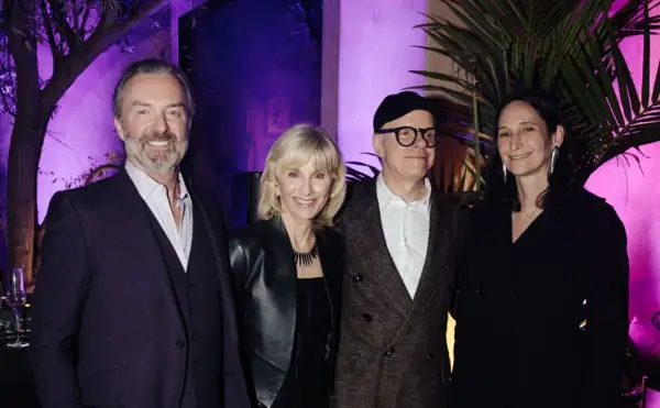 Four individuals pose at an event for the Serpentine Americas Foundation.
