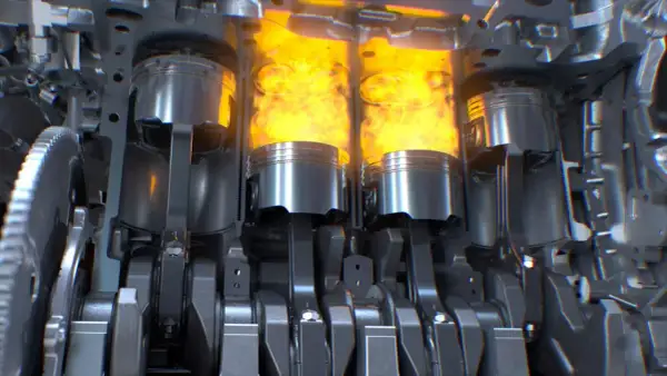 Vue en coupe d'un moteur thermique, montrant les pistons en action avec des flammes vives. Le mécanisme complexe du vilebrequin et des bielles est visible.