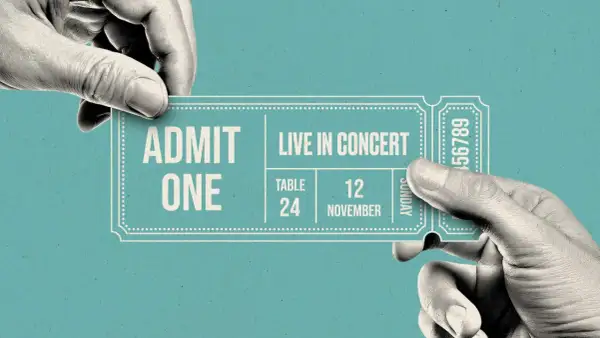 Hands exchange a concert ticket. A resale ticket means someone is selling their ticket to another person, often at a different price.