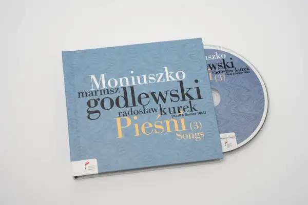 Płyta CD z nagraniem "Pieśni" Moniuszki w wykonaniu Mariusza Godlewskiego i Radosława Kurka. Prząśniczka tekst na okładce.